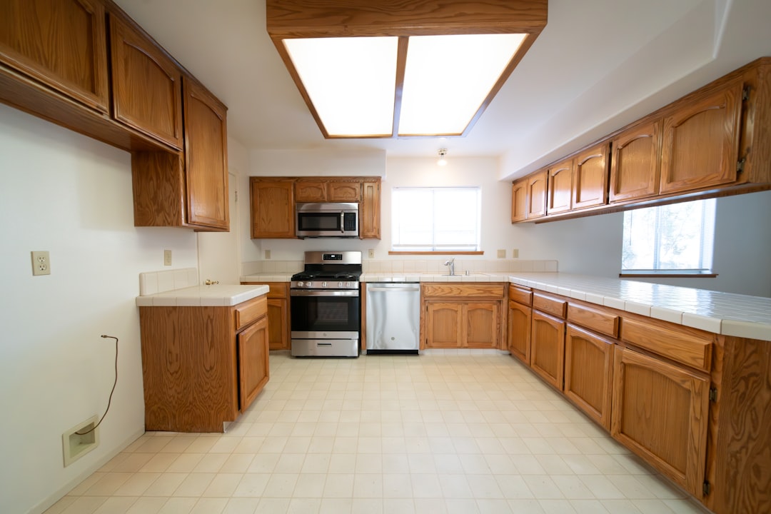 a-kitchen-with-a-stove-dishwasher-microwave-and-cabinets-skxcmyi48lg